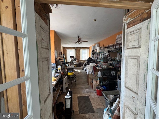 interior space with ceiling fan