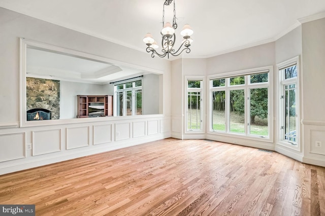 unfurnished dining area featuring crown molding, light hardwood / wood-style flooring, and plenty of natural light