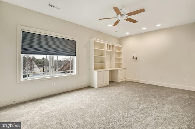 interior space with ceiling fan