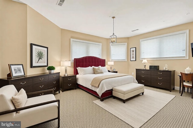 bedroom with light colored carpet