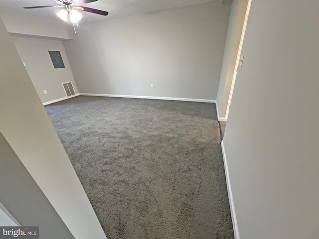 carpeted spare room with ceiling fan