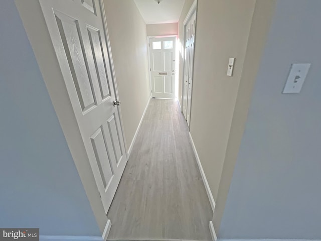 hallway featuring light hardwood / wood-style flooring