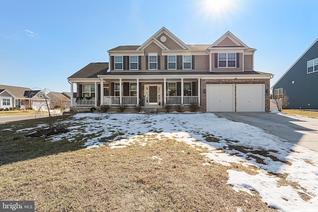 view of front of home with a garage and covered porch