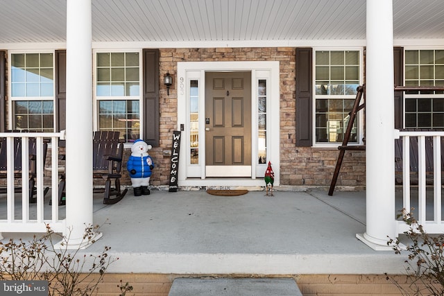 property entrance featuring covered porch