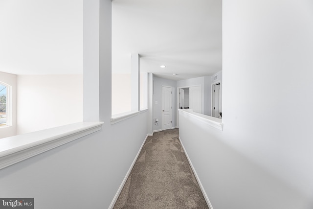 corridor with carpet flooring