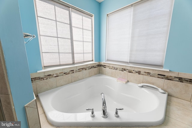 bathroom with tiled tub