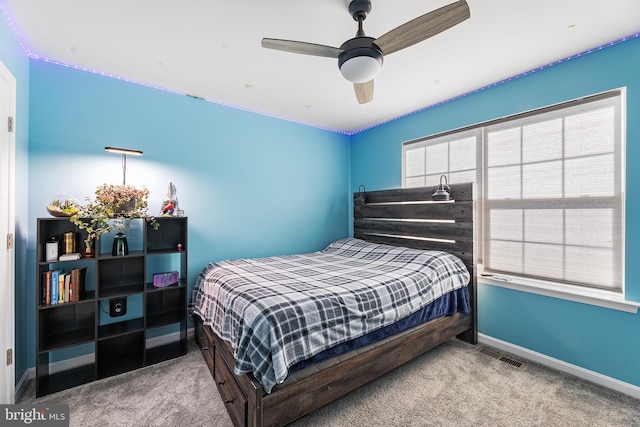 bedroom with light colored carpet and ceiling fan