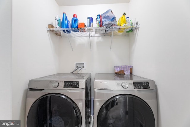 washroom with washing machine and dryer