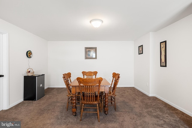 view of carpeted dining area