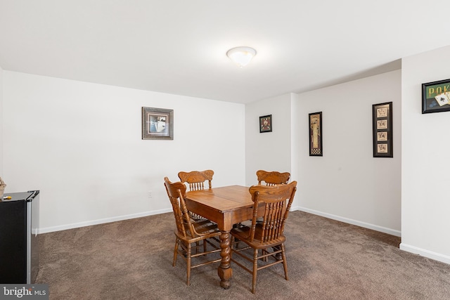 view of carpeted dining space