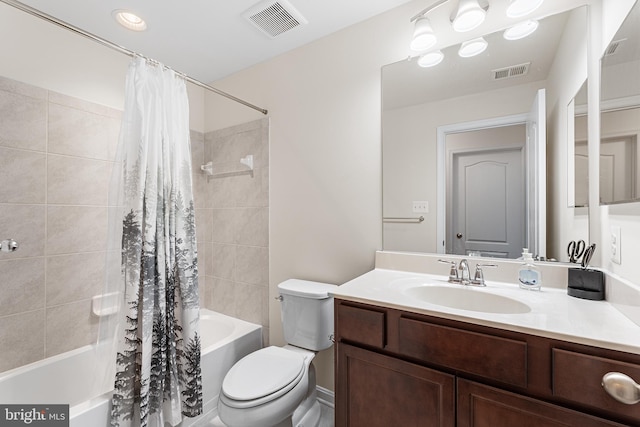 full bathroom with vanity, toilet, and shower / bath combo with shower curtain