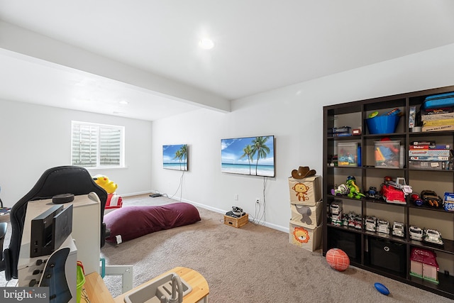 carpeted bedroom with beamed ceiling