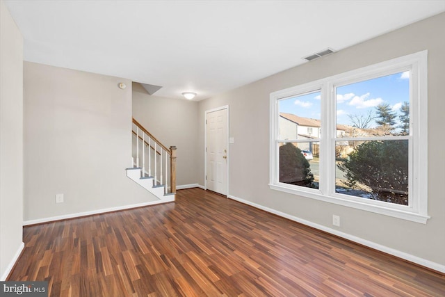 entrance foyer featuring dark hardwood / wood-style flooring