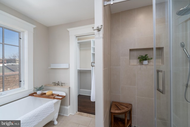 bathroom featuring tile patterned floors and plus walk in shower