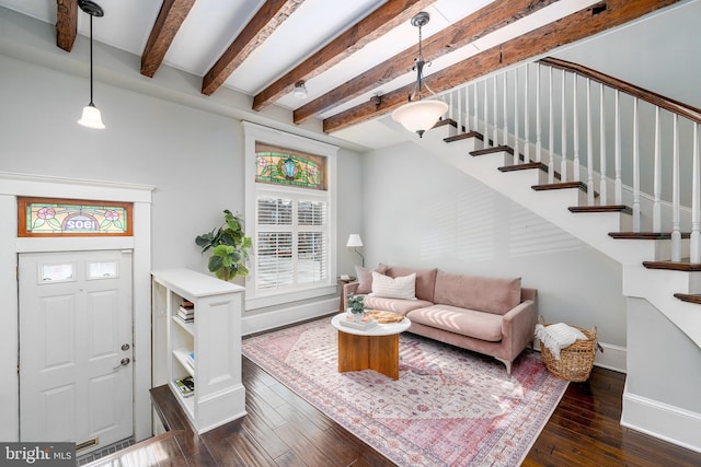 living room featuring beam ceiling and dark hardwood / wood-style flooring