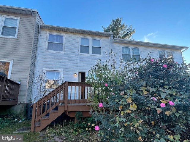 rear view of house featuring a deck