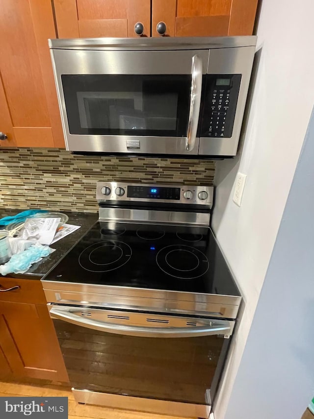 details with stainless steel appliances and tasteful backsplash