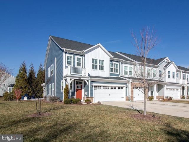 view of property featuring a garage and a front lawn