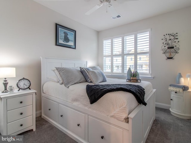 bedroom featuring dark colored carpet and ceiling fan