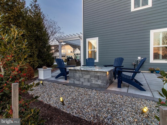 view of patio featuring a fire pit and a pergola