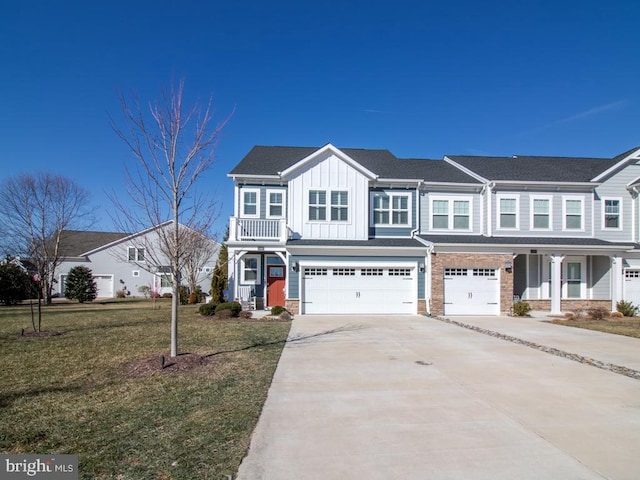 townhome / multi-family property featuring a garage and a front lawn