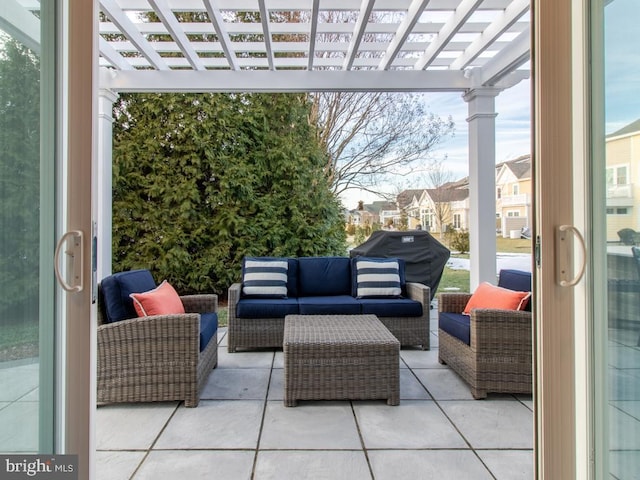 view of patio featuring an outdoor living space and a pergola