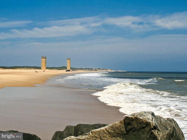 property view of water featuring a view of the beach