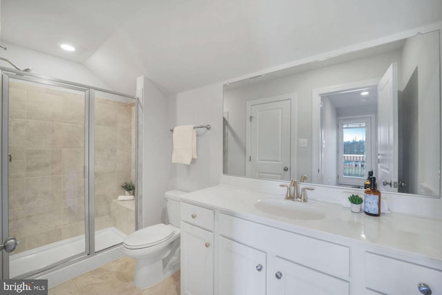 bathroom featuring vanity, toilet, tile patterned floors, and walk in shower