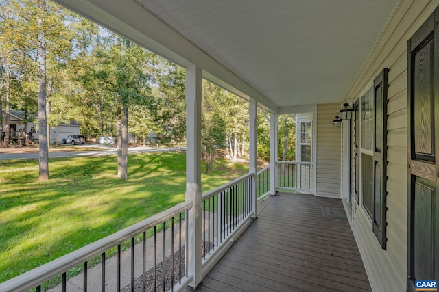 wooden terrace featuring covered porch