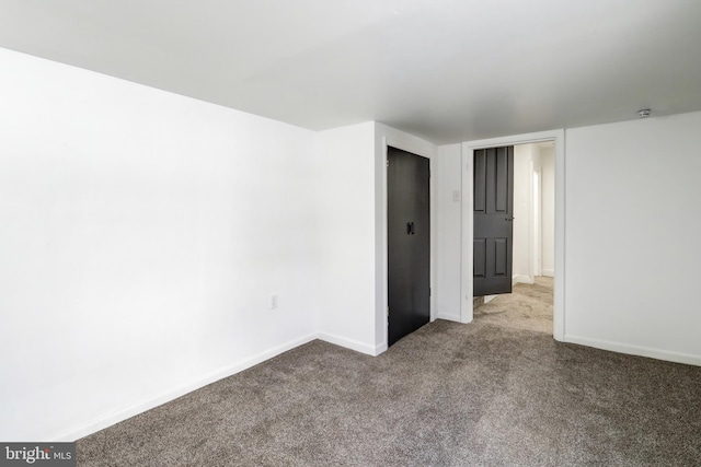 unfurnished room with carpet flooring