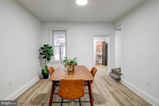 dining room featuring light hardwood / wood-style flooring