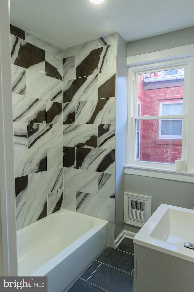 bathroom featuring tile patterned flooring and vanity