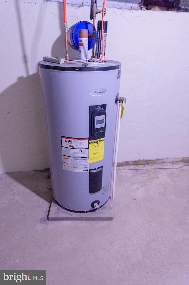 utility room featuring electric water heater