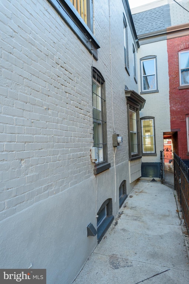 view of property exterior featuring brick siding