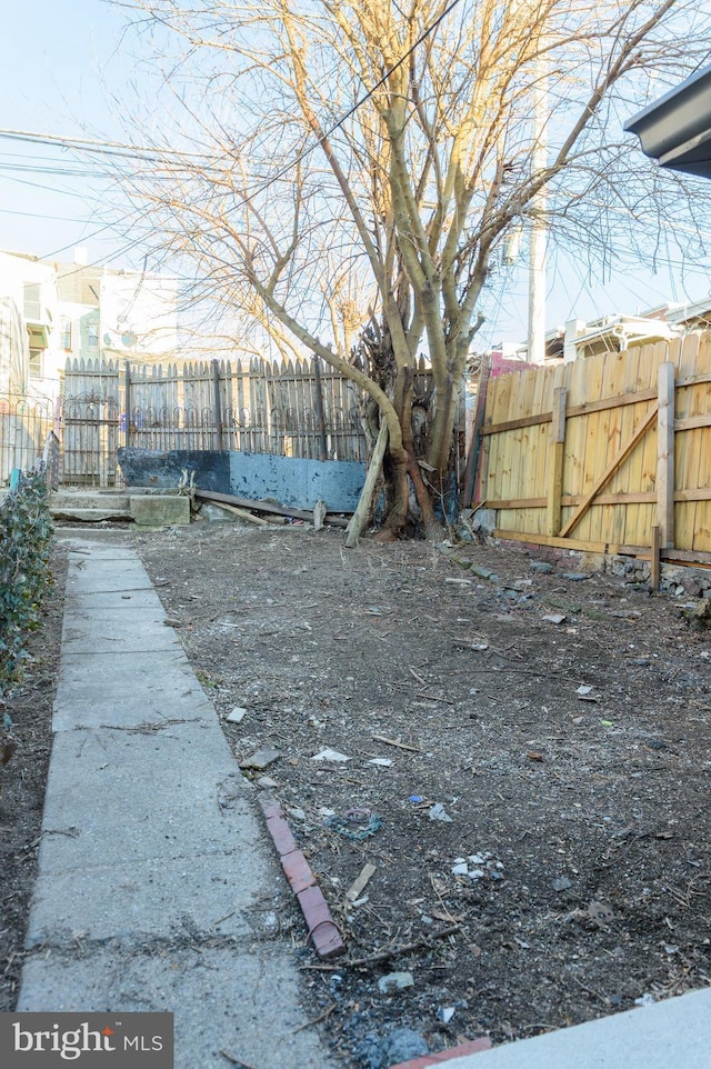 view of yard with a fenced backyard