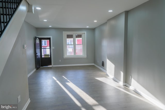 entryway featuring stairs, recessed lighting, wood finished floors, and baseboards