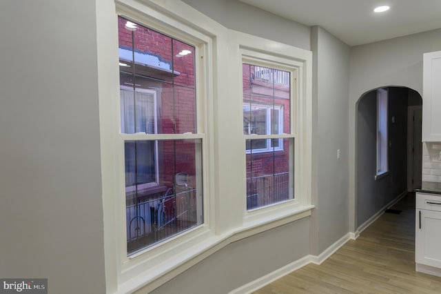 interior space with recessed lighting, baseboards, and light wood-style flooring