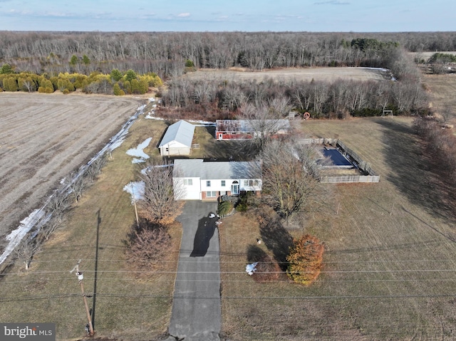 birds eye view of property with a rural view