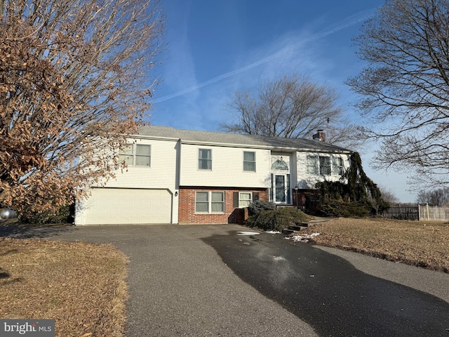 bi-level home featuring a garage