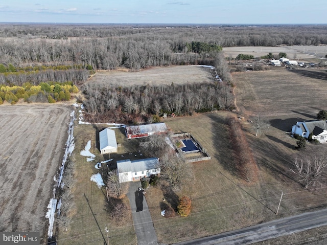 birds eye view of property with a rural view