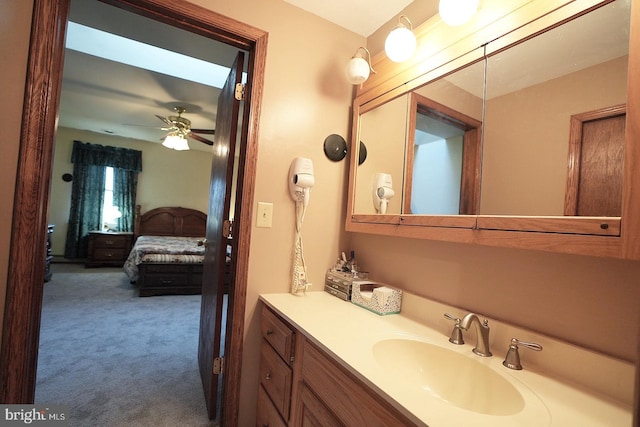 bathroom featuring ceiling fan and vanity