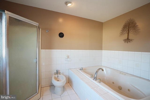 bathroom with a bidet, separate shower and tub, tile walls, and tile patterned floors