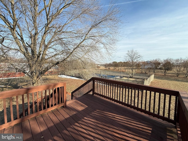 wooden deck featuring a rural view