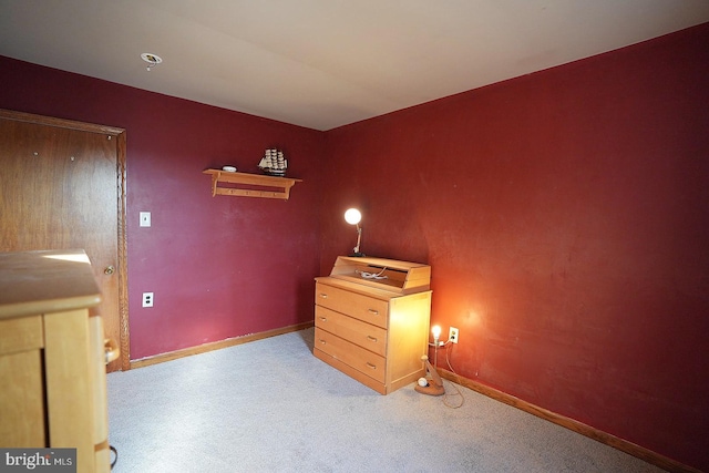 unfurnished bedroom with light colored carpet