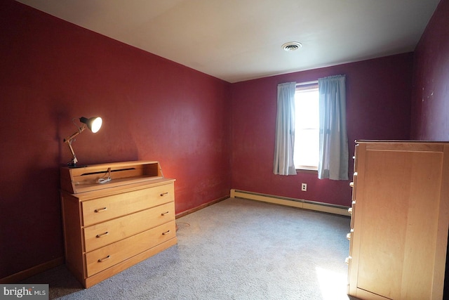 unfurnished bedroom featuring a baseboard heating unit and light colored carpet