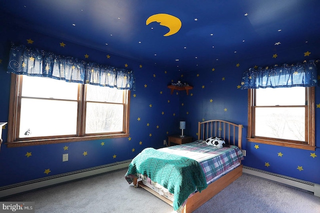 bedroom with carpet floors and a baseboard radiator