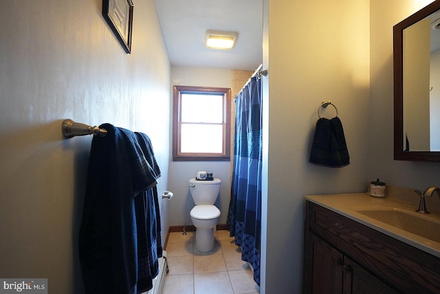 bathroom with tile patterned floors, toilet, and vanity