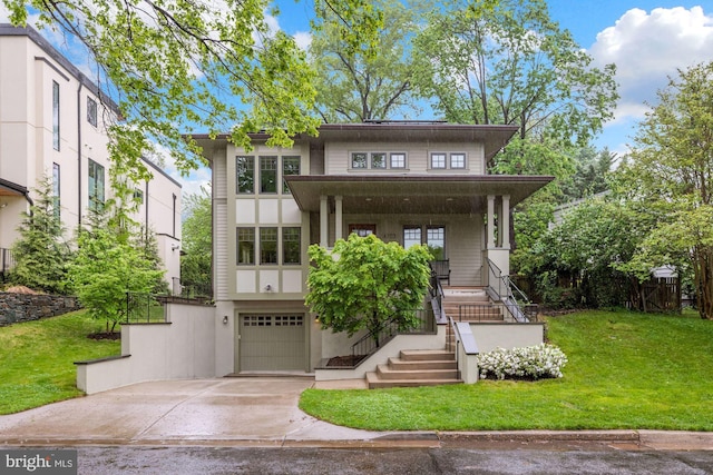 view of front of property with a garage, a front lawn, and a porch