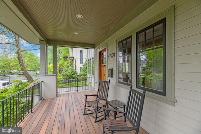 wooden terrace featuring a porch