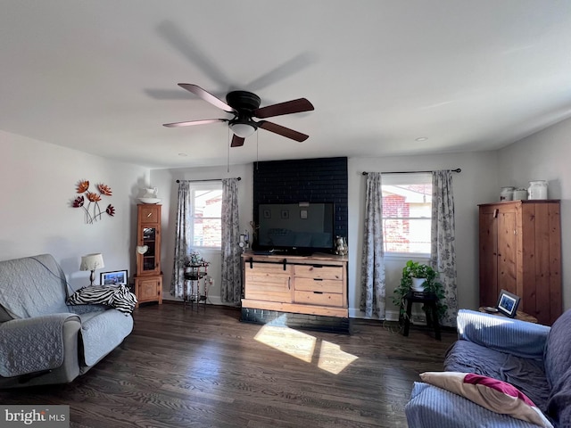 living room with ceiling fan, dark hardwood / wood-style floors, and a healthy amount of sunlight